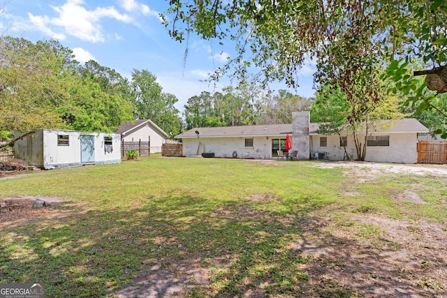 705 Oak Ln, Brunswick, GA 31523 - view of yard featuring a storage unit