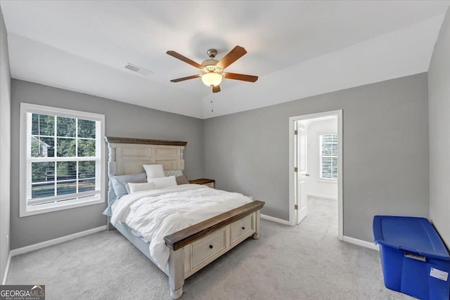 bedroom featuring ceiling fan, baseboards, visible vents, and carpet