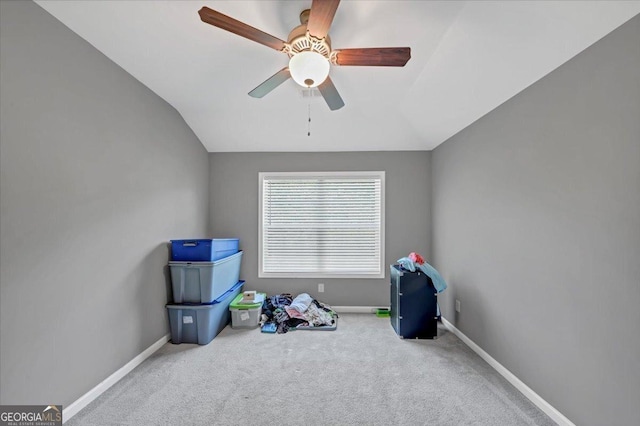 rec room featuring ceiling fan, vaulted ceiling, baseboards, and carpet flooring