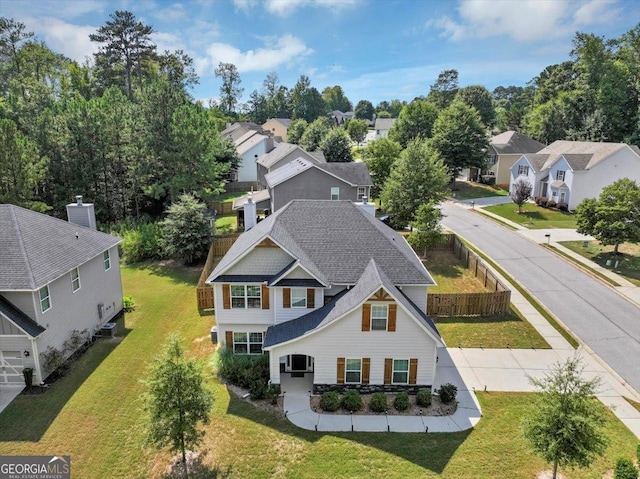 birds eye view of property with a residential view