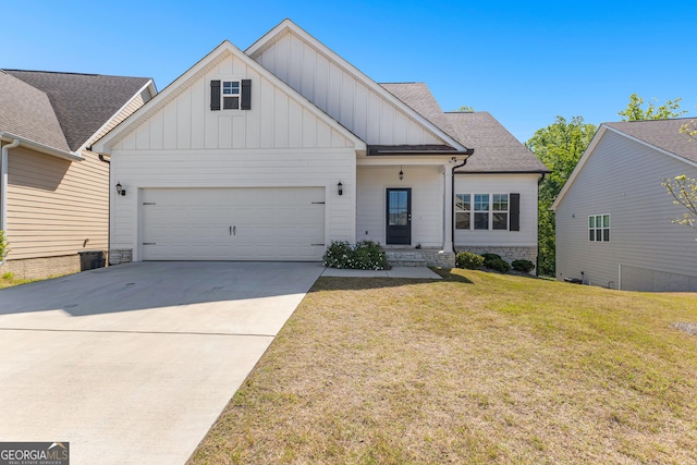 517 Lago Ct, Lagrange, GA 30241 - view of front of house with concrete driveway, board and batten siding, an attached garage, a front yard, and roof with shingles