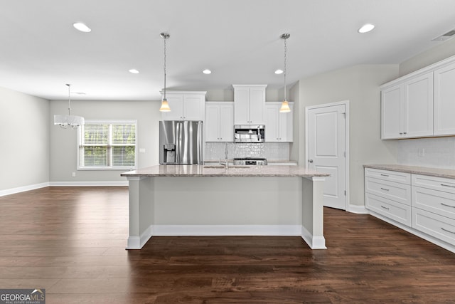 517 Lago Ct, Lagrange, GA 30241 - kitchen with appliances with stainless steel finishes, light stone counters, dark wood-style floors, and recessed lighting