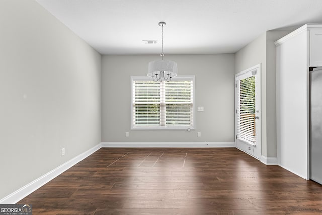517 Lago Ct, Lagrange, GA 30241 - unfurnished dining area featuring dark wood-style floors, an inviting chandelier, visible vents, and baseboards