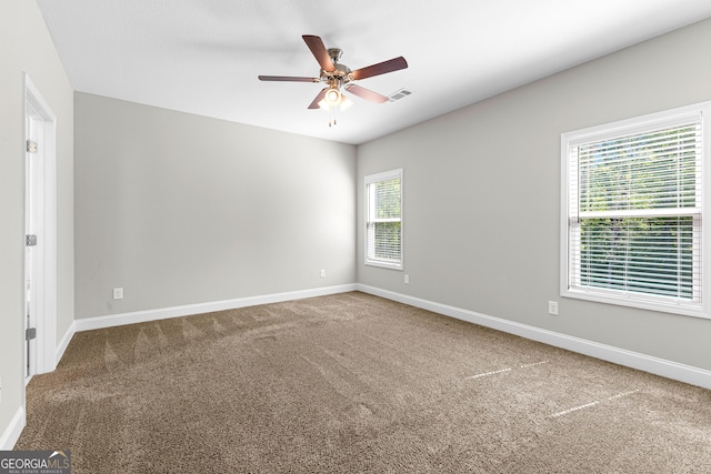 517 Lago Ct, Lagrange, GA 30241 - unfurnished room featuring a wealth of natural light, a ceiling fan, visible vents, and carpet