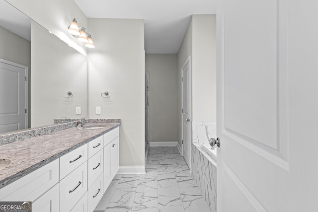 517 Lago Ct, Lagrange, GA 30241 - full bath featuring marble finish floor, double vanity, a sink, a bath, and baseboards