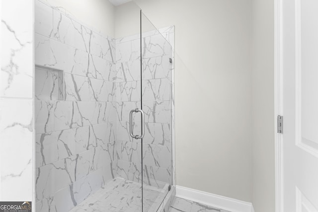 517 Lago Ct, Lagrange, GA 30241 - bathroom featuring marble finish floor, baseboards, and a marble finish shower