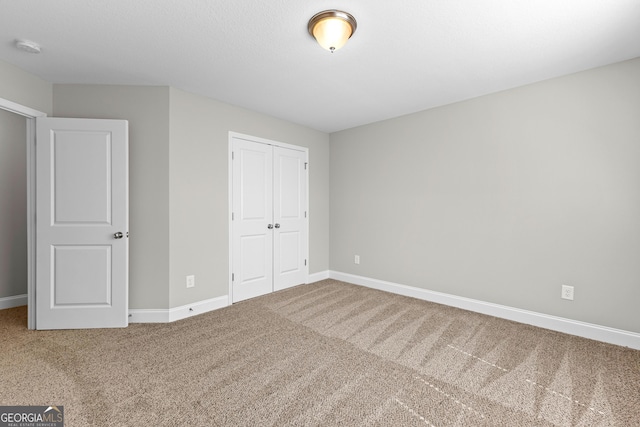 517 Lago Ct, Lagrange, GA 30241 - unfurnished bedroom with carpet floors, a closet, and baseboards