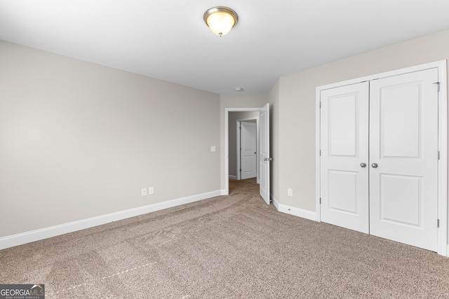 517 Lago Ct, Lagrange, GA 30241 - unfurnished bedroom with carpet, a closet, and baseboards