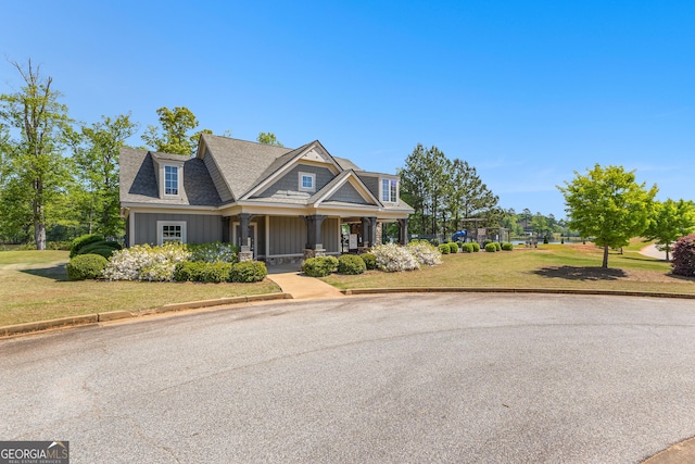 517 Lago Ct, Lagrange, GA 30241 - craftsman inspired home featuring a porch, stone siding, board and batten siding, and a front yard