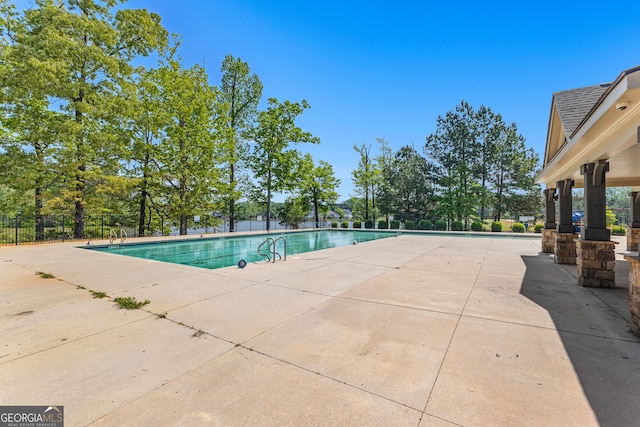 517 Lago Ct, Lagrange, GA 30241 - pool with fence and a patio area