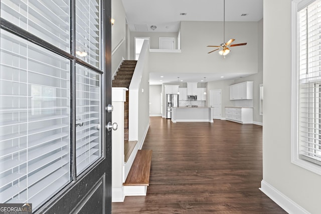 517 Lago Ct, Lagrange, GA 30241 - entryway featuring ceiling fan, a towering ceiling, baseboards, dark wood-type flooring, and visible vents
