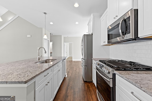 517 Lago Ct, Lagrange, GA 30241 - kitchen featuring white cabinets, stainless steel appliances, a sink, tasteful backsplash, and dark wood finished floors
