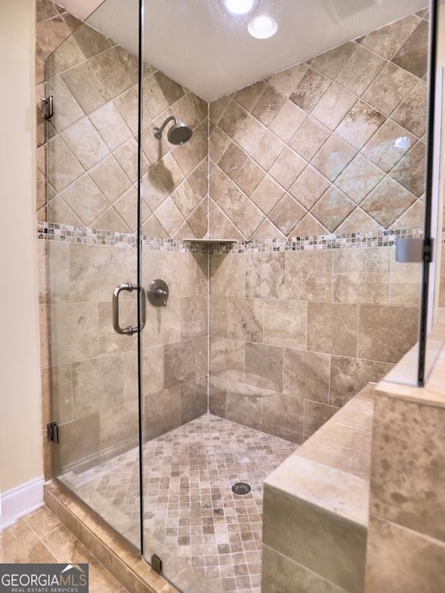 bathroom featuring a shower stall and recessed lighting
