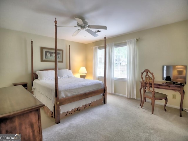 carpeted bedroom featuring a ceiling fan, baseboards, and visible vents