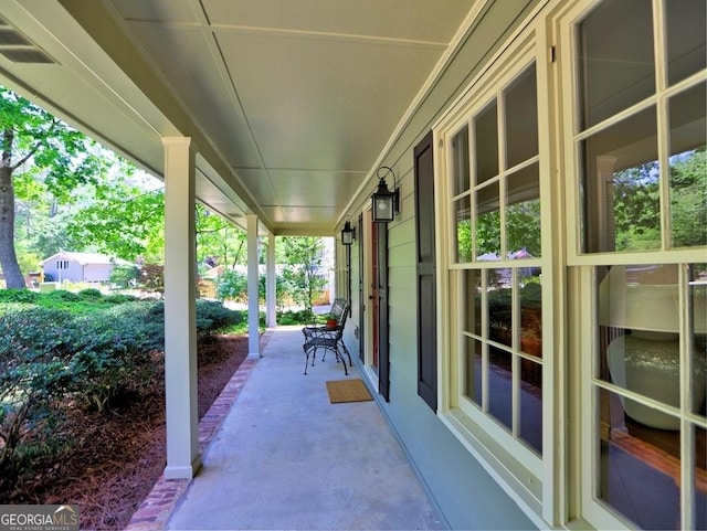 view of patio featuring a porch and visible vents