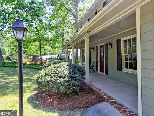 view of yard with covered porch