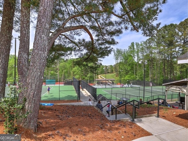 view of sport court with fence