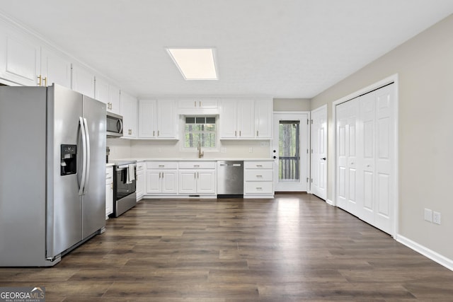 499 Old Deer Path Way, Cleveland, GA 30528 - kitchen featuring white cabinetry, stainless steel appliances, light countertops, and dark wood-style floors