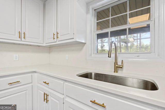 499 Old Deer Path Way, Cleveland, GA 30528 - kitchen with light countertops, white cabinets, and a sink