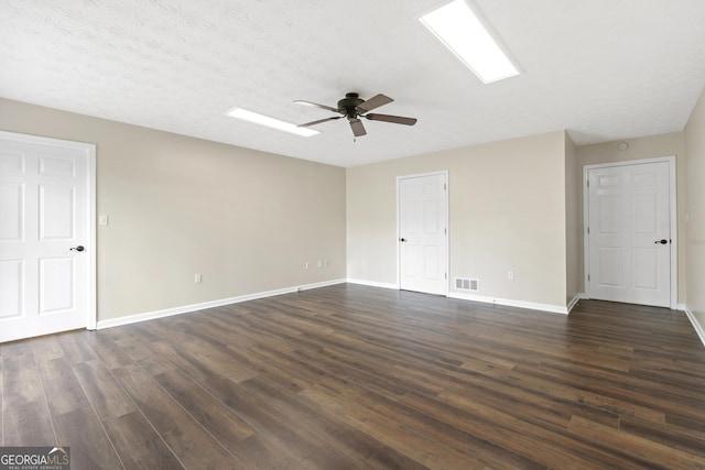 499 Old Deer Path Way, Cleveland, GA 30528 - unfurnished room featuring dark wood-style flooring, ceiling fan, visible vents, and baseboards
