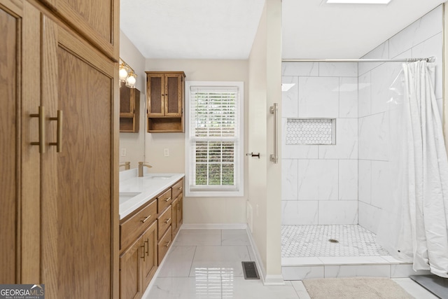 499 Old Deer Path Way, Cleveland, GA 30528 - bathroom with a sink, a tile shower, double vanity, visible vents, and baseboards