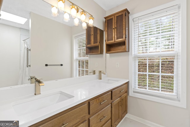 499 Old Deer Path Way, Cleveland, GA 30528 - full bathroom with double vanity, a sink, and a healthy amount of sunlight