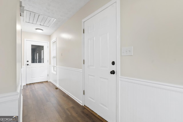 499 Old Deer Path Way, Cleveland, GA 30528 - hallway featuring attic access, a wainscoted wall, visible vents, and dark wood-type flooring