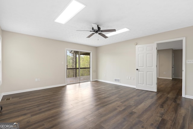 499 Old Deer Path Way, Cleveland, GA 30528 - unfurnished room featuring dark wood finished floors, visible vents, ceiling fan, and baseboards