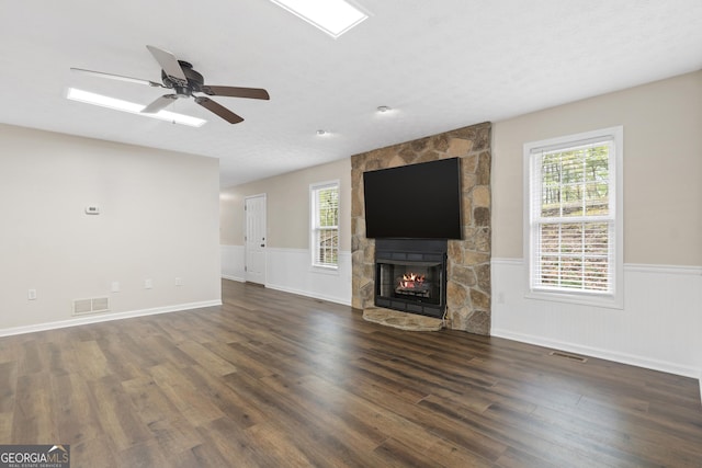 499 Old Deer Path Way, Cleveland, GA 30528 - unfurnished living room featuring a sink, a fireplace, ceiling fan, light wood-style flooring, and baseboards
