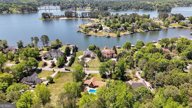 bird's eye view with a forest view, a residential view, and a water view