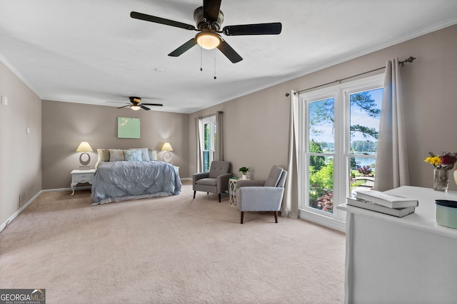bedroom with ceiling fan, ornamental molding, baseboards, and light carpet