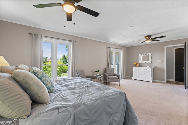 bedroom featuring ornamental molding, light carpet, a ceiling fan, and baseboards