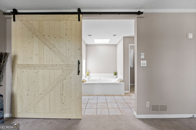 bathroom with a bath, baseboards, ornamental molding, tile patterned flooring, and visible vents
