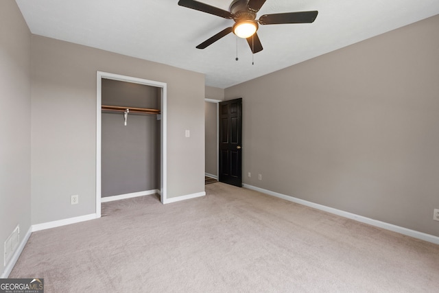 unfurnished bedroom with a closet, carpet flooring, baseboards, and visible vents