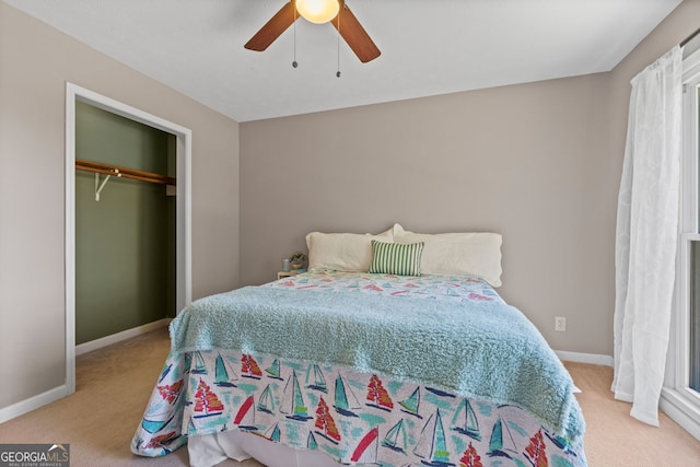 bedroom with carpet, a closet, baseboards, and ceiling fan