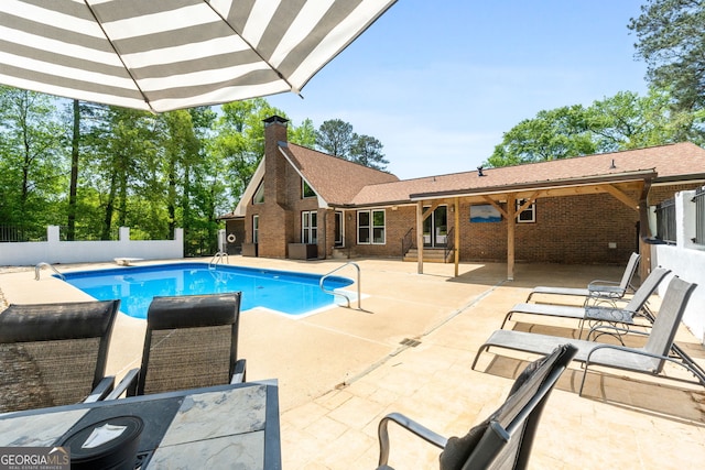 view of swimming pool with fence private yard, a patio area, and a fenced in pool