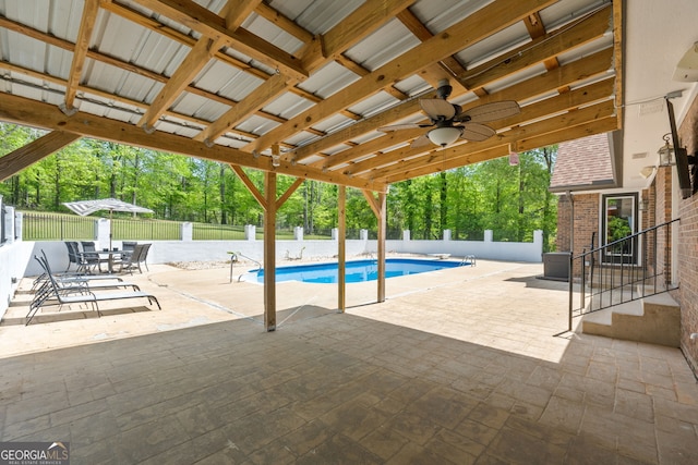 view of pool with a fenced backyard, a ceiling fan, a fenced in pool, and a patio