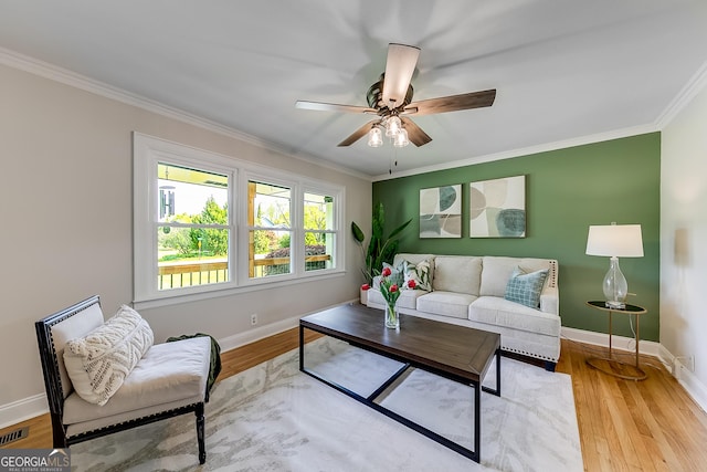 17 Spring Cir, Watkinsville, GA 30677 - living room with ornamental molding, ceiling fan, baseboards, and wood finished floors