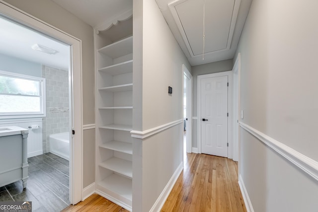 17 Spring Cir, Watkinsville, GA 30677 - corridor featuring attic access, light wood-type flooring, and baseboards