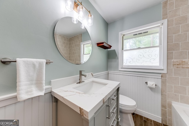 17 Spring Cir, Watkinsville, GA 30677 - bathroom with a wainscoted wall, vanity, toilet, and wood finished floors
