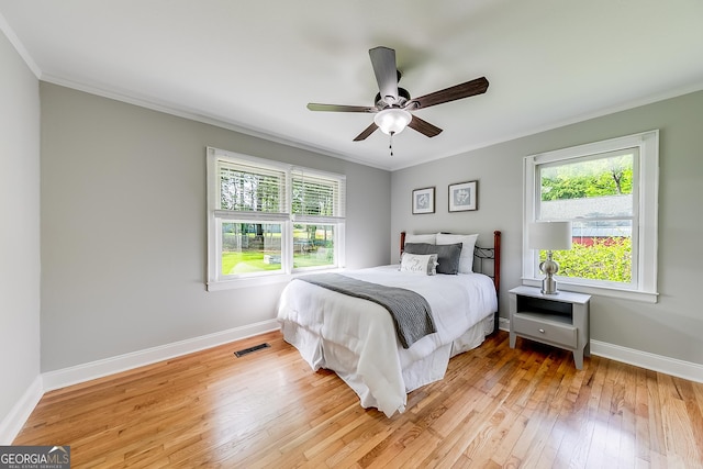 17 Spring Cir, Watkinsville, GA 30677 - bedroom featuring crown molding, hardwood / wood-style flooring, multiple windows, baseboards, and a ceiling fan