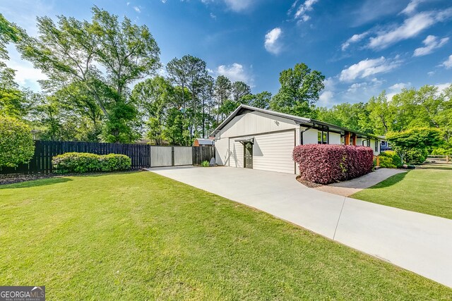 17 Spring Cir, Watkinsville, GA 30677 - view of property exterior featuring driveway, a gate, and a garage