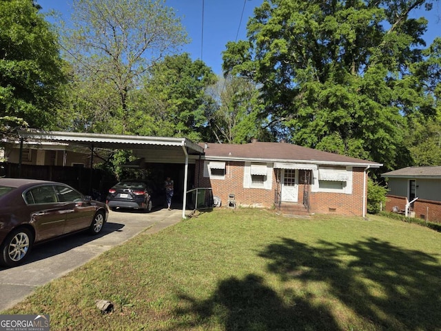 single story home with a front lawn, an attached carport, concrete driveway, brick siding, and crawl space