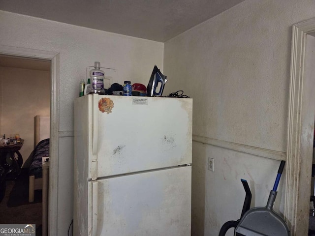 kitchen with freestanding refrigerator