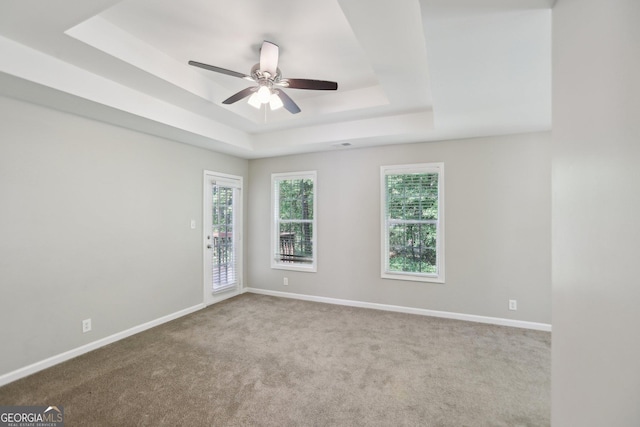1945 Grayson Oaks Ct, Lawrenceville, GA 30045 - carpeted empty room with baseboards, a tray ceiling, and ceiling fan
