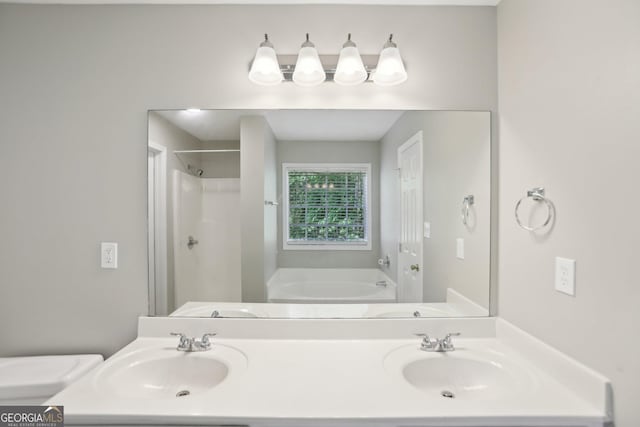1945 Grayson Oaks Ct, Lawrenceville, GA 30045 - full bath featuring a sink, double vanity, toilet, and a shower
