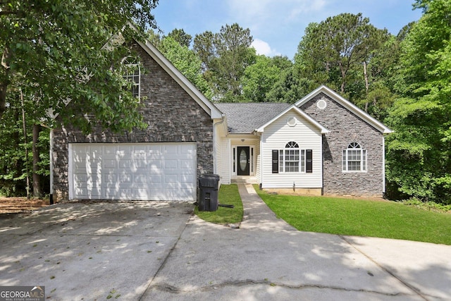 1945 Grayson Oaks Ct, Lawrenceville, GA 30045 - ranch-style house featuring a garage, concrete driveway, a front yard, and stone siding