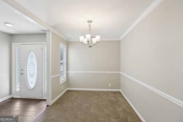 1945 Grayson Oaks Ct, Lawrenceville, GA 30045 - entryway with crown molding, baseboards, a notable chandelier, and visible vents