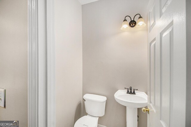 1085 Crown River Pkwy, Mcdonough, GA 30252 - washroom featuring hookup for an electric dryer, washer hookup, baseboards, and dark wood-type flooring