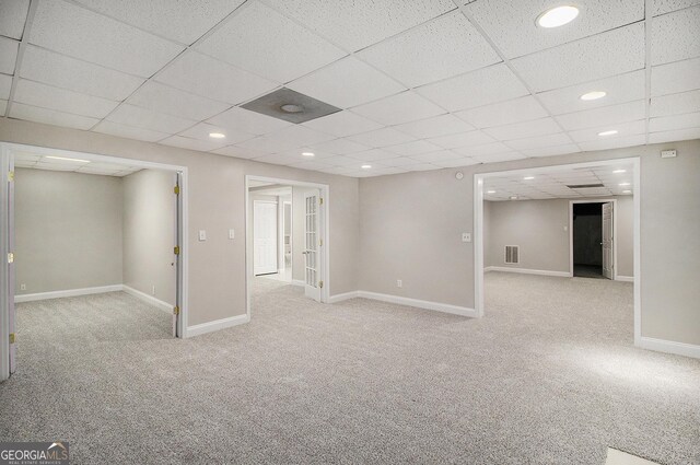 1085 Crown River Pkwy, Mcdonough, GA 30252 - carpeted spare room with a paneled ceiling, baseboards, and recessed lighting